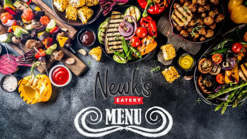 Delicious grilled vegetables, skewers, and sauces on a dark textured surface. Festive and colorful arrangement with "Newk's Eatery Menu" text. Newk's Eatery Mandeville Menu